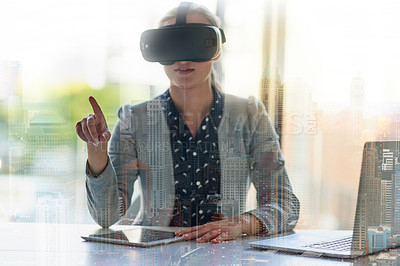 Buy stock photo Shot of a young businesswoman wearing a virtual reality headset at work