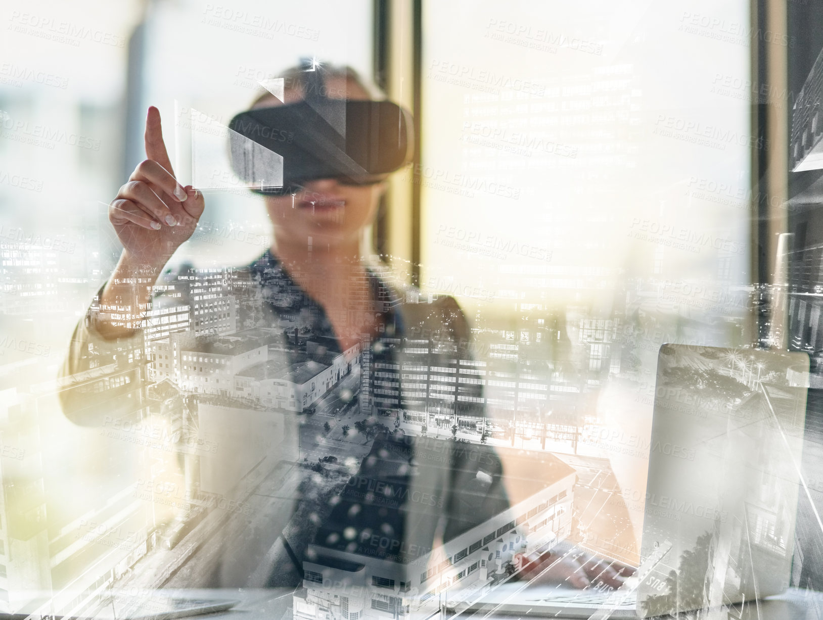 Buy stock photo Shot of a young businesswoman wearing a virtual reality headset at work