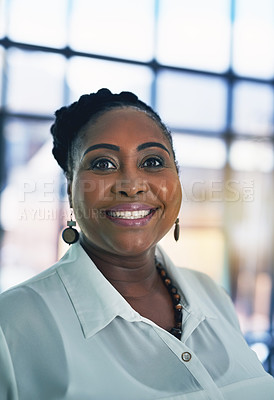 Buy stock photo Portrait of a happy businesswoman posing alone in the office