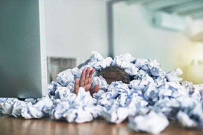 Buy stock photo Shot of an unidentifiable businessman drowning under a pile of paperwork