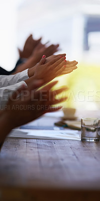 Buy stock photo Shot of a group of unidentifiable businesspeople applauding at the boardroom table