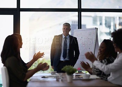 Buy stock photo Shot of a team of silhouetted businesspeople attending a meeting in the boardroom