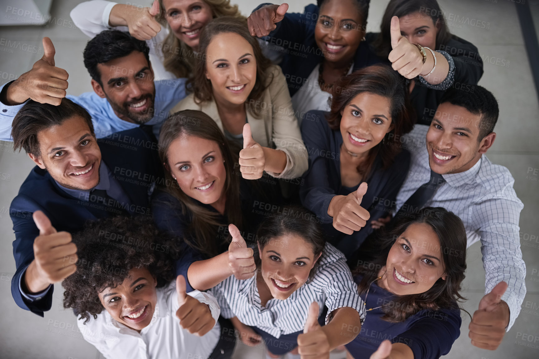 Buy stock photo High angle portrait of a group of coworkers showing a thumbs up in the office
