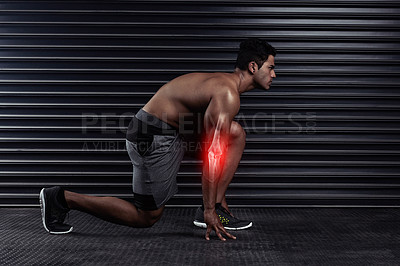 Buy stock photo Full length shot of an athletic young man on his mark before a run