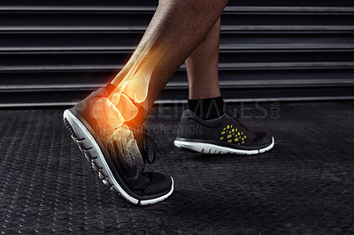 Buy stock photo Cropped shot of an unrecognizable man working out with an ankle injury