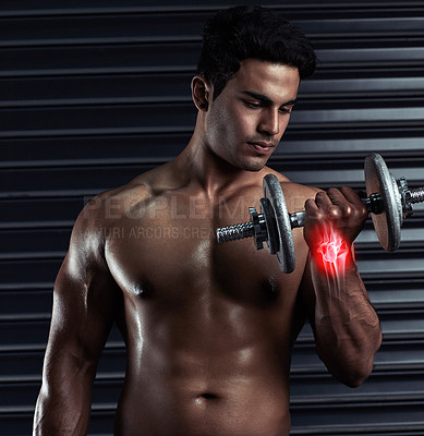 Buy stock photo Man, dumbbell and workout for wrist injury at gym, accident and fibromyalgia or red glow for tendon. Male person, weightlifting and athlete for bone fracture or joint pain, inflammation and sore