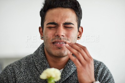 Buy stock photo Cropped shot of a young man suffering with allergies