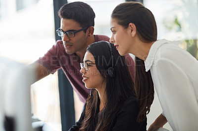 Buy stock photo Shot of colleagues working together in an office