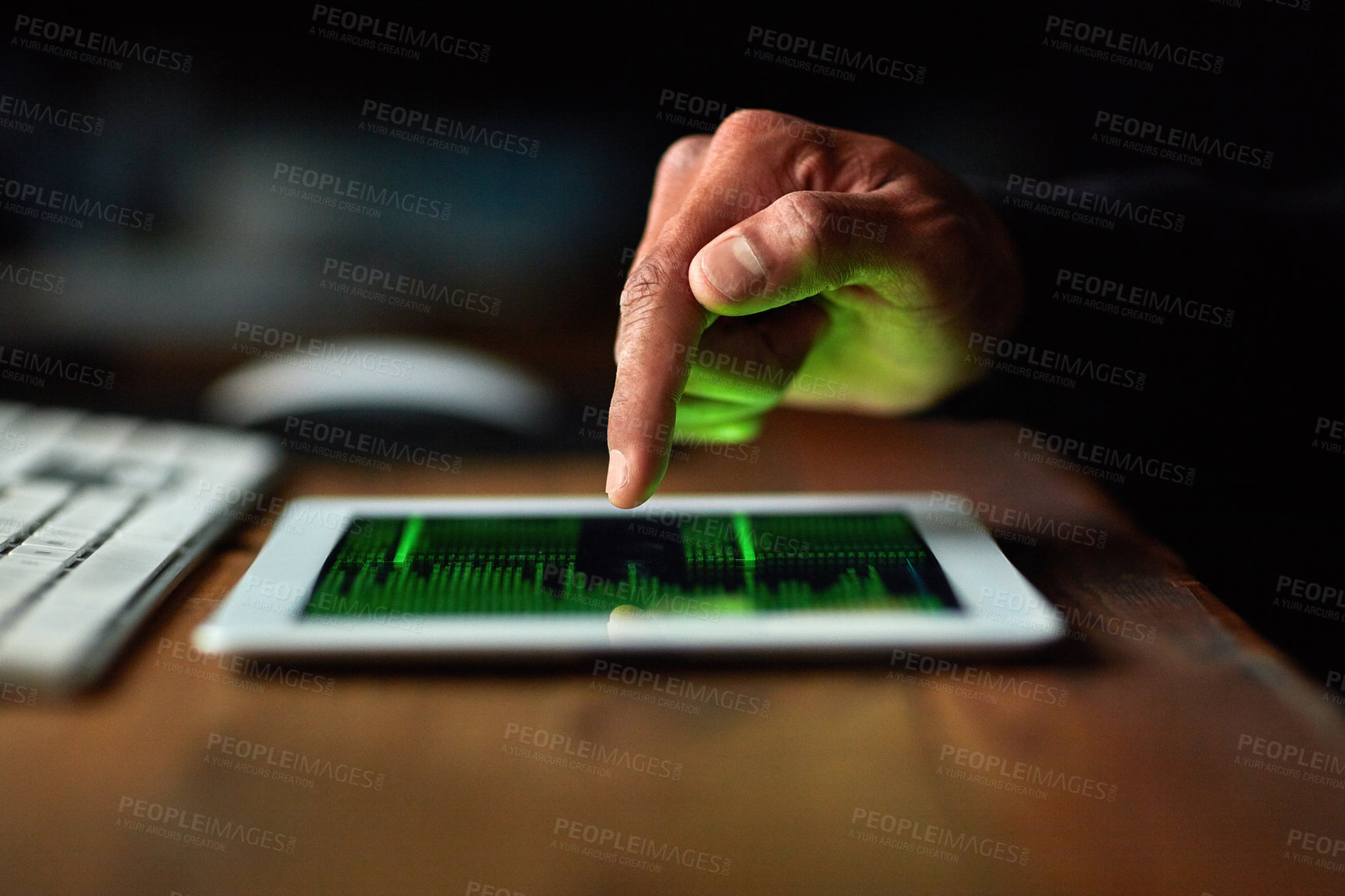 Buy stock photo Cropped shot of an unidentifiable hacker cracking a computer code in the dark