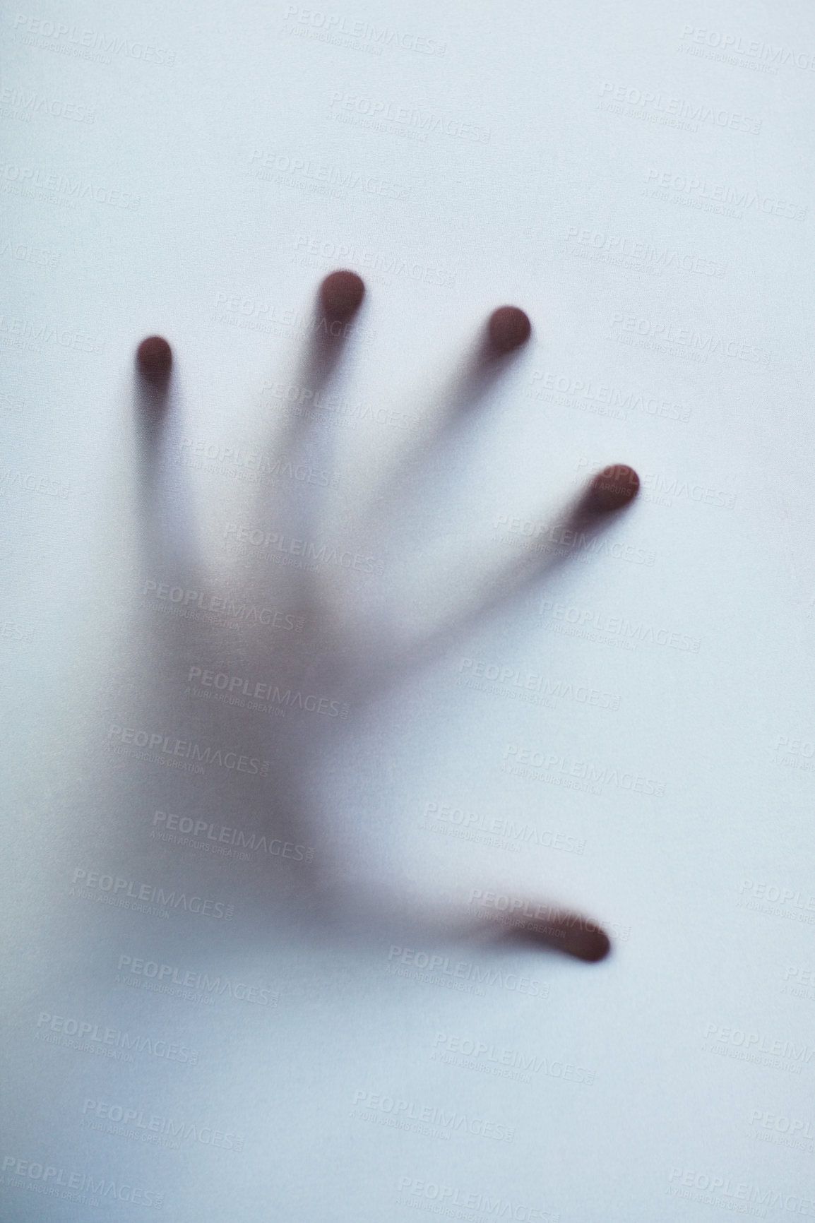Buy stock photo Defocussed shot of a single hand reaching out against a plain background