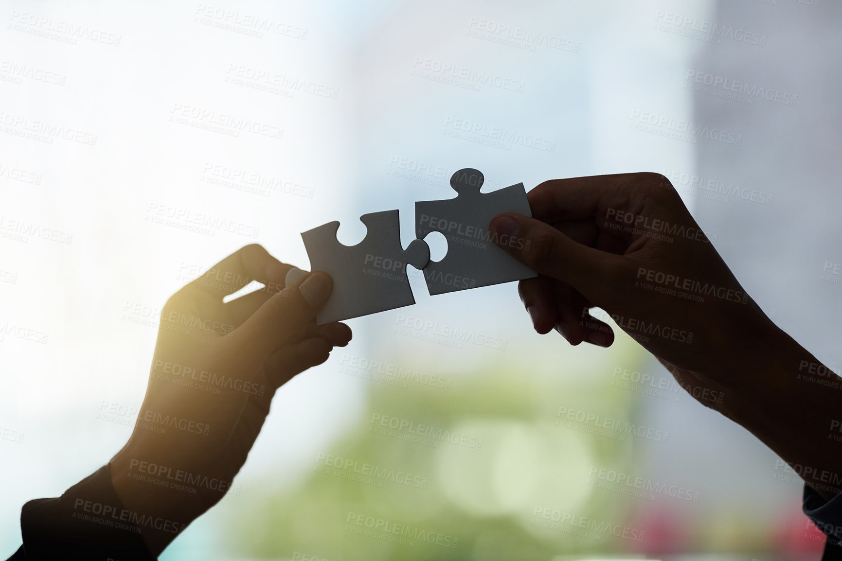 Buy stock photo Hands, puzzle and silhouette with for solution in office for connection, teamwork or link with people. Jigsaw game, pieces and toys for synergy, collaboration or strategy for problem solving at job