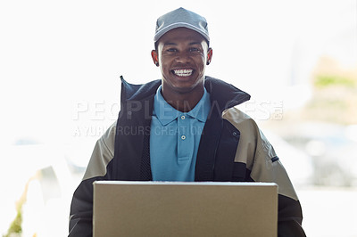 Buy stock photo Portrait of a courier holding a box for delivery