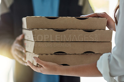 Buy stock photo Cropped shot of a man making a pizza delivery to a customer