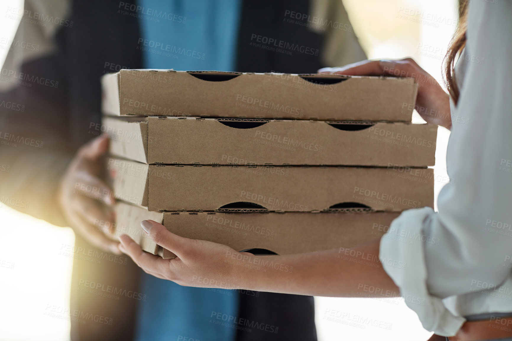 Buy stock photo Cropped shot of a man making a pizza delivery to a customer