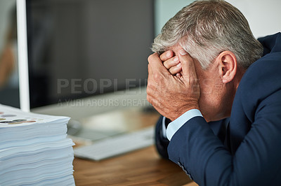 Buy stock photo Cropped shot of a mature businessman feeling stressed in the office