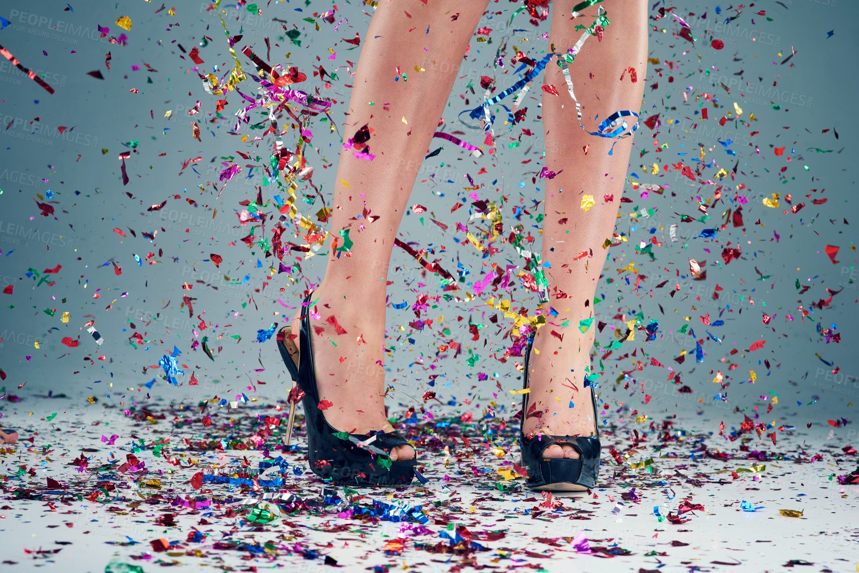 Buy stock photo Woman, legs and heels with confetti for party or celebration of new years or decoration for event. Person, shoes and sparkling sequins on floor for festive, birthday or surprise on studio background 