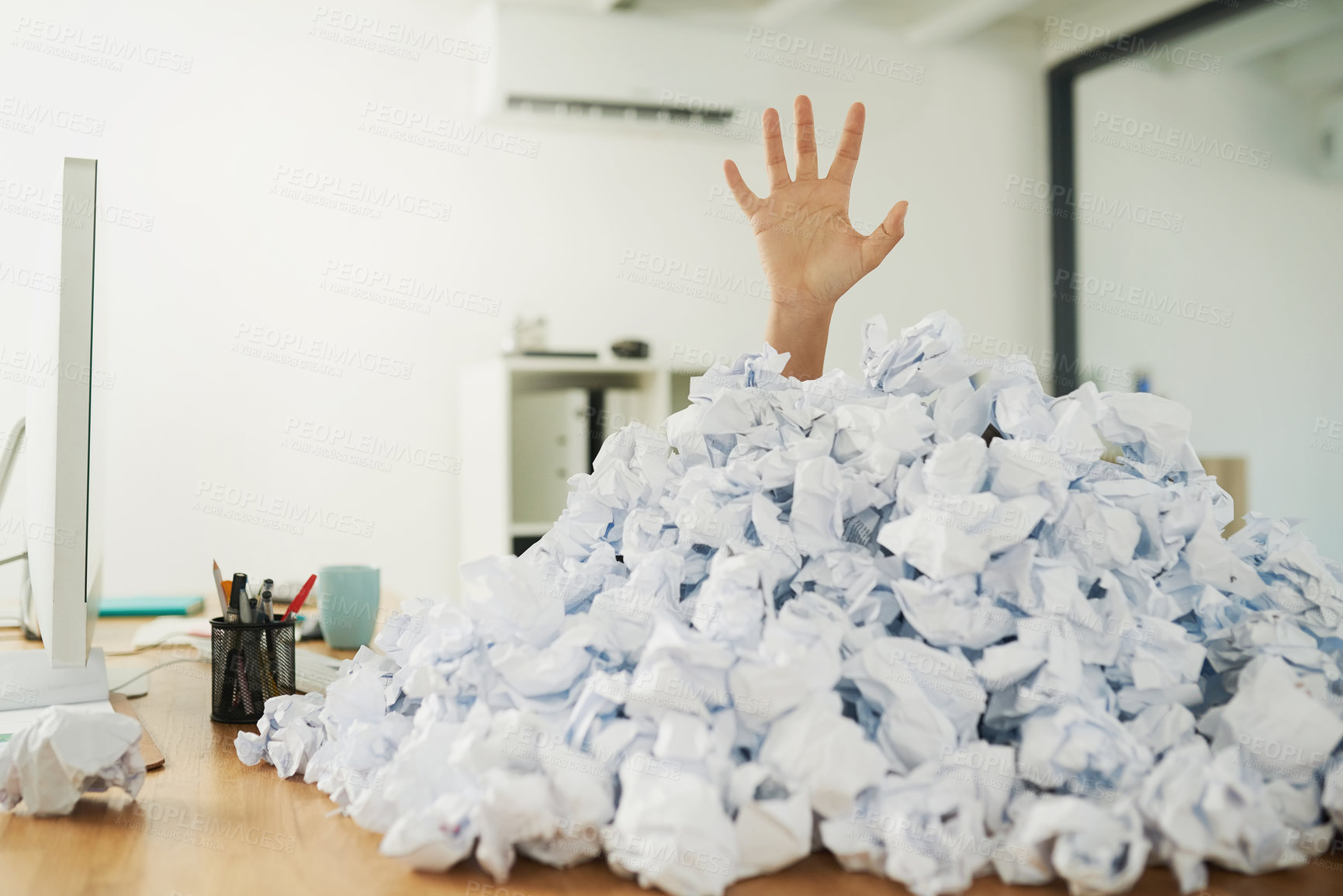 Buy stock photo Shot of an unidentifiable businesswoman drowning under a pile of paperwork in the office