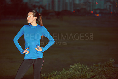 Buy stock photo Shot of a young woman out for a run