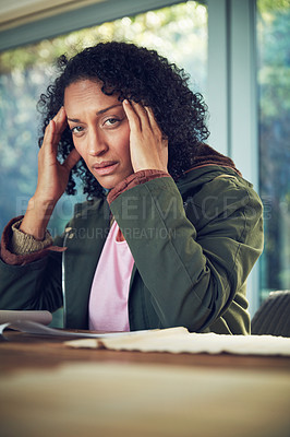 Buy stock photo Portrait of a mature woman experiencing a headache