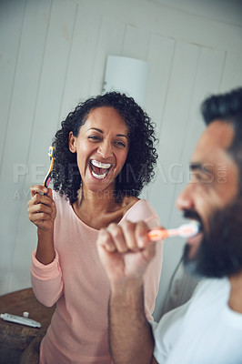 Buy stock photo Couple, brushing teeth and laughing in bathroom, happy and love in morning routine, play or funny joke. People, cleaning mouth and oral hygiene or sanitary or health and wellness, fresh and self care