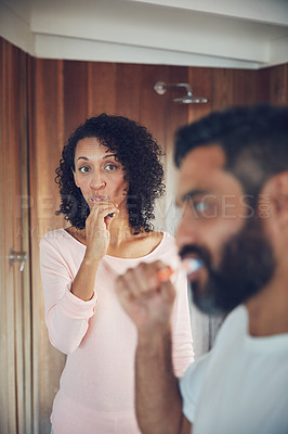 Buy stock photo Bathroom, couple and brushing teeth together in routine, thinking and dental in morning, Man and woman, cleaning mouth and fresh by oral hygiene, self care and health or wellness in sanitary home