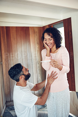 Buy stock photo Couple, surprise and stomach with pregnancy test, positive and bed with smile, results and excited. Man, woman and baby with stick, love and maternity for future family, happy and pregnancy together