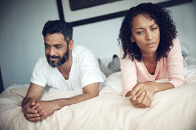 Buy stock photo Divorce, conflict and couple in bedroom for problem, frustrated and marriage fail with mental health risk. Thinking, fighting and woman with man, home and relationship issue with anxiety and stress