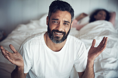 Buy stock photo Portrait of a mature man looking confused while his wife sleeps in the background