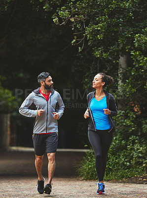 Buy stock photo Couple, running in park for exercise and health outdoor, support and training for marathon with cardio. Runner, athlete and sport with people in nature, challenge and fitness with workout for race