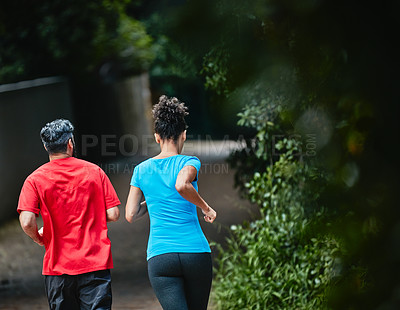 Buy stock photo Shot of a couple out running together