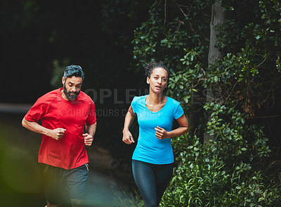 Buy stock photo People, running in park for exercise and health outdoor, support and training for marathon with cardio. Runner, athlete and sport with couple in nature, challenge and fitness with workout for race