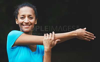 Buy stock photo Shot of a woman loosening up before her workout