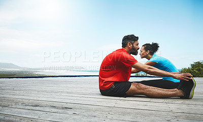 Buy stock photo Couple, stretching and legs in exercise at beach to start fitness, training or outdoor with blue sky mockup. Workout, preparation and people together for sports, performance and feet on a deck