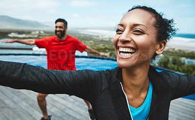 Buy stock photo Fitness, wellness and couple doing outdoor yoga stretching together on a rooftop of a building. Happy, smile and young man and woman doing a pilates warm up exercise or workout for health in nature.