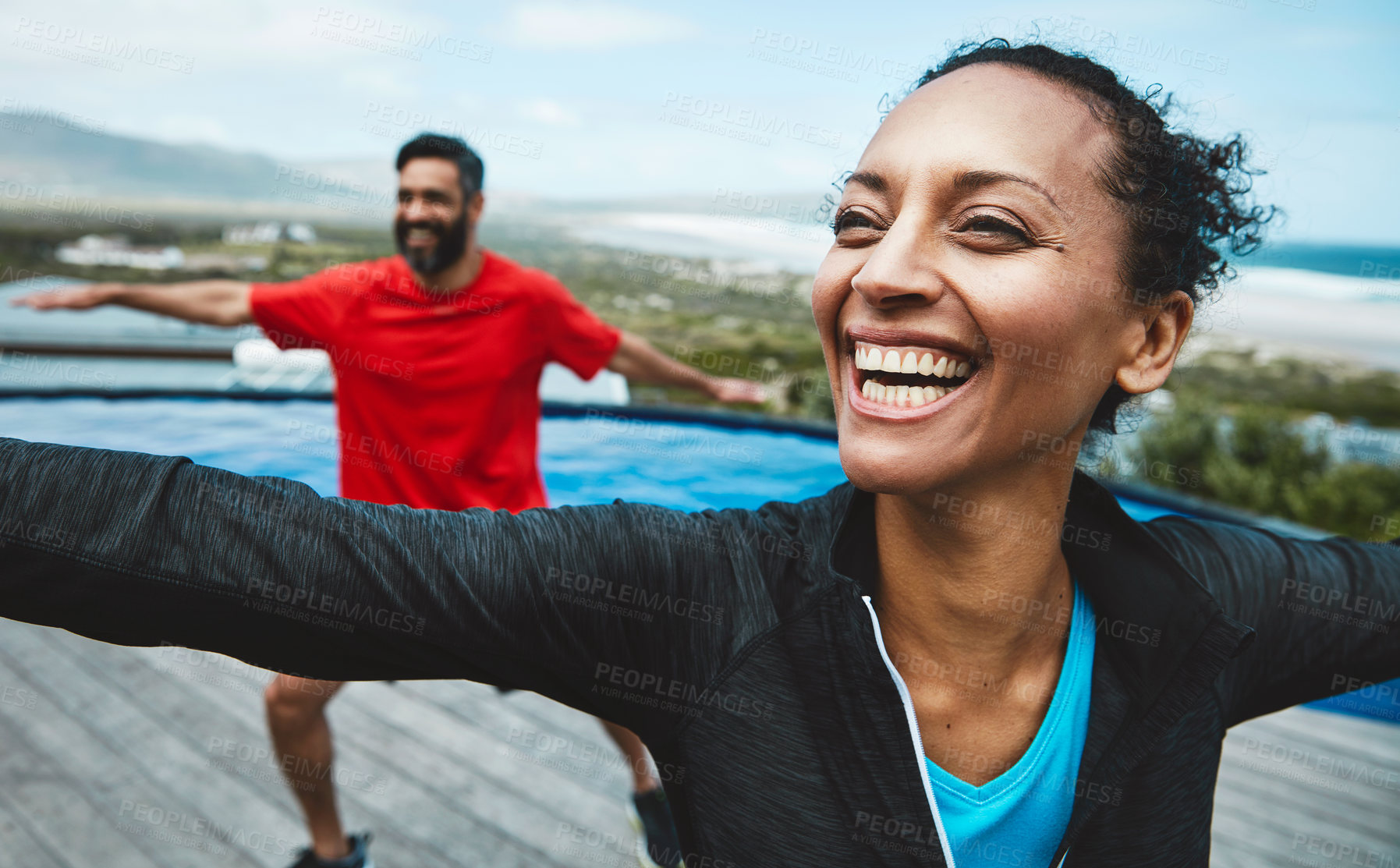 Buy stock photo Fitness, wellness and couple doing outdoor yoga stretching together on a rooftop of a building. Happy, smile and young man and woman doing a pilates warm up exercise or workout for health in nature.