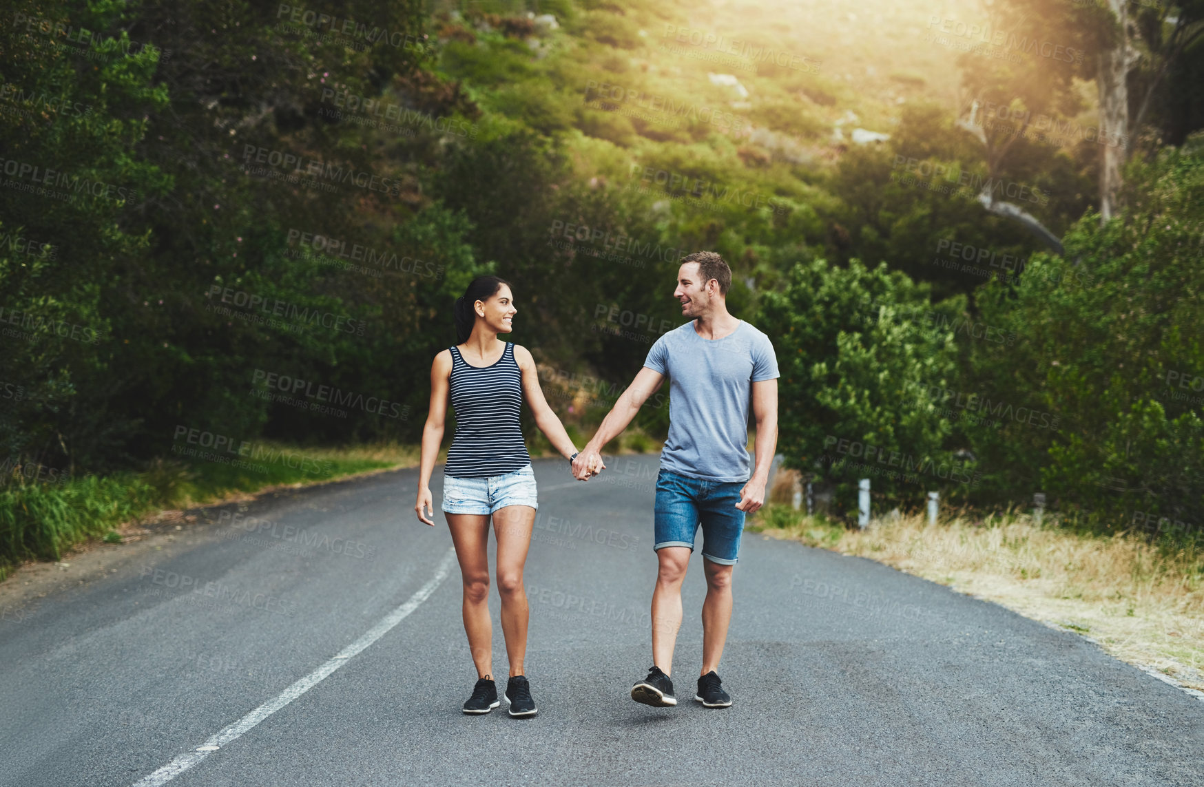 Buy stock photo Road, love or happy couple holding hands or walking on date with smile, care for romance or adventure. Peace, freedom or man with woman on holiday vacation together for bond, support or wellness