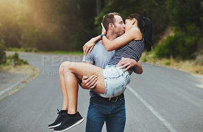 Buy stock photo Lift, love or couple kiss on road or outdoor date with loyalty for romance, freedom or adventure. Care, trust or romantic man with woman on holiday vacation for bond, support or wellness on street 