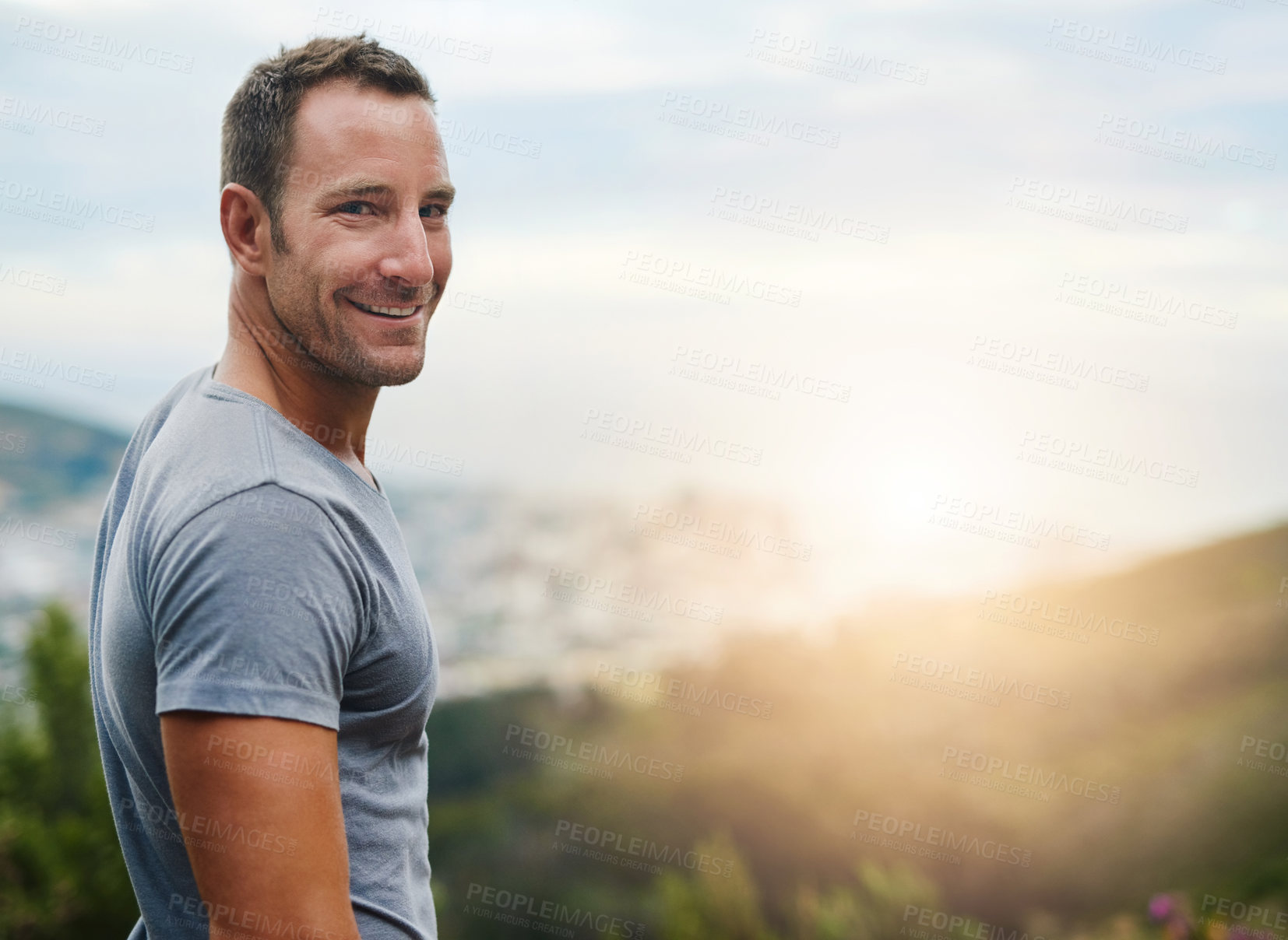 Buy stock photo Portrait, space or happy man in park, nature or outdoor with confidence or freedom on holiday vacation. Travel, sunrise or person in summer, natural environment or blue sky mockup to smile or relax