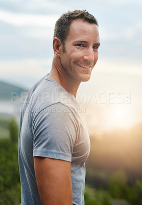 Buy stock photo Portrait, smile or happy man in park, nature or outdoor with confidence or freedom on holiday vacation. Face, sunrise or person hiking in summer, natural environment to travel or relax for wellness