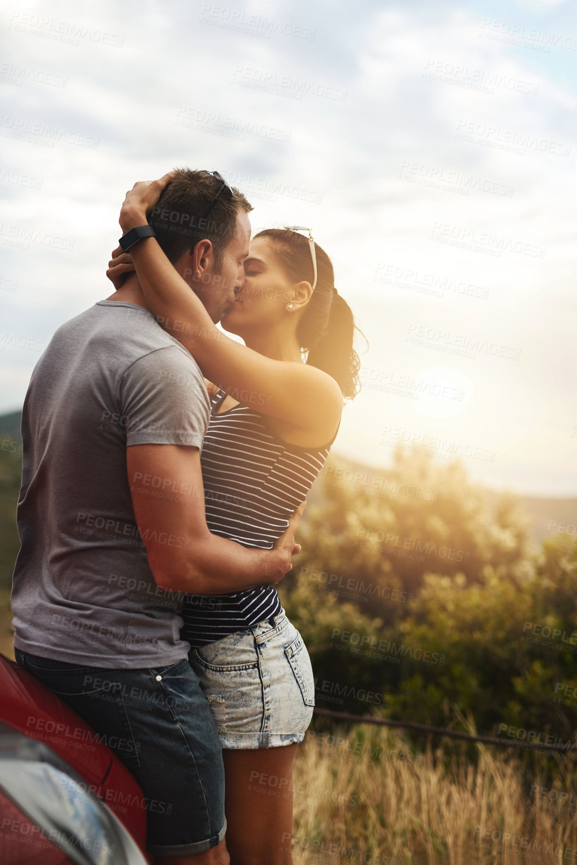 Buy stock photo Road trip, love or couple kiss in park for date, support or care on a summer romance or adventure. Relax, hug or man with woman on outdoor holiday vacation together for bond, travel or breka