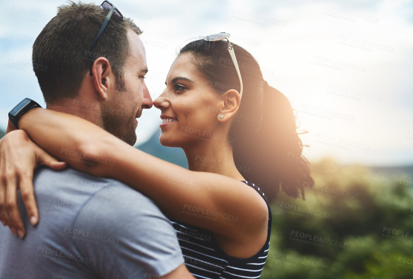 Buy stock photo Trust, love or happy couple hug in park for date, support or care in nature with peace, bond or freedom. Eye contact, romantic man or woman on outdoor holiday vacation together to relax or travel