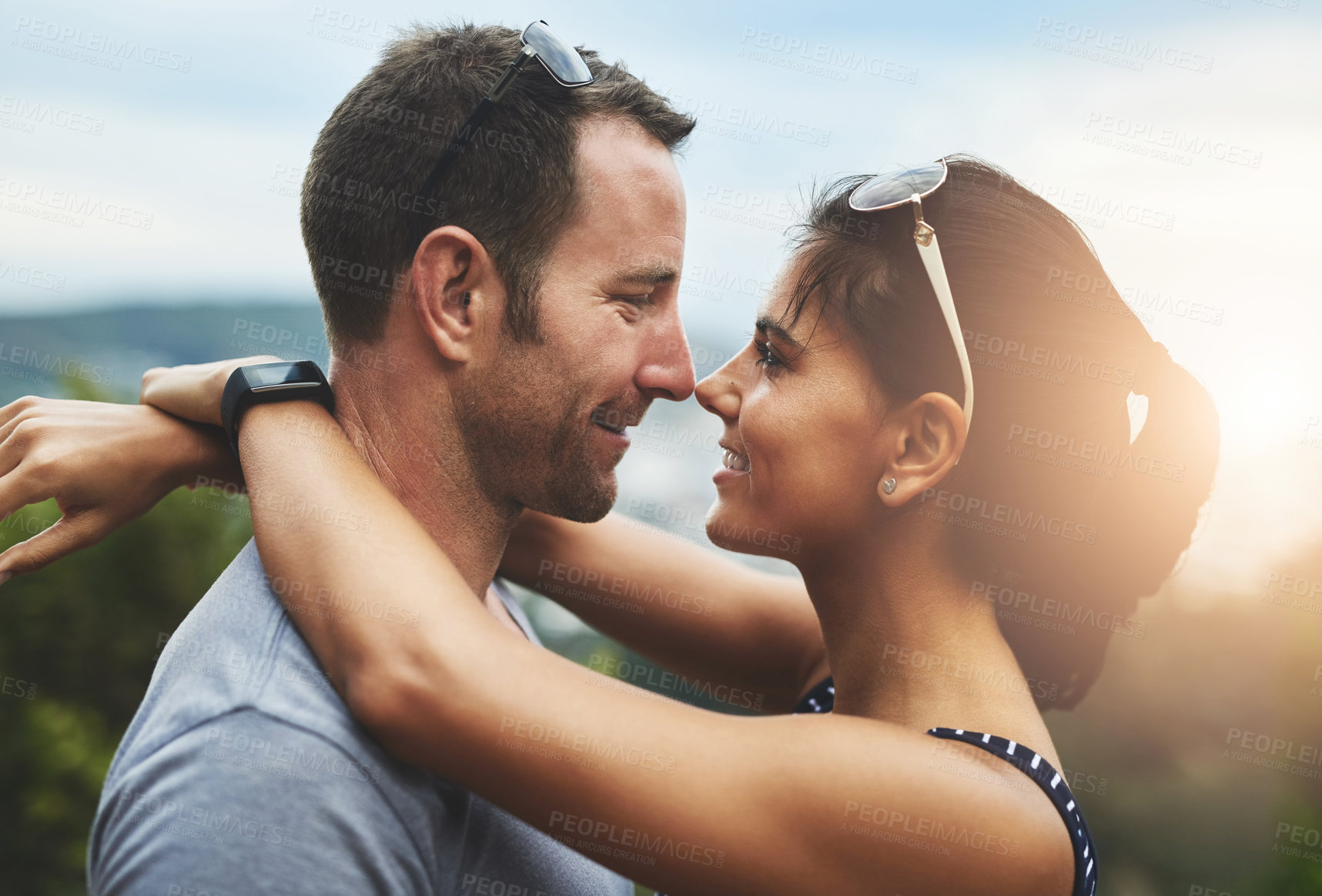 Buy stock photo People, love or happy couple hug in park for date, support or care in nature with peace, bond or marriage. Eye contact, romantic man or woman on outdoor holiday vacation together to relax or travel