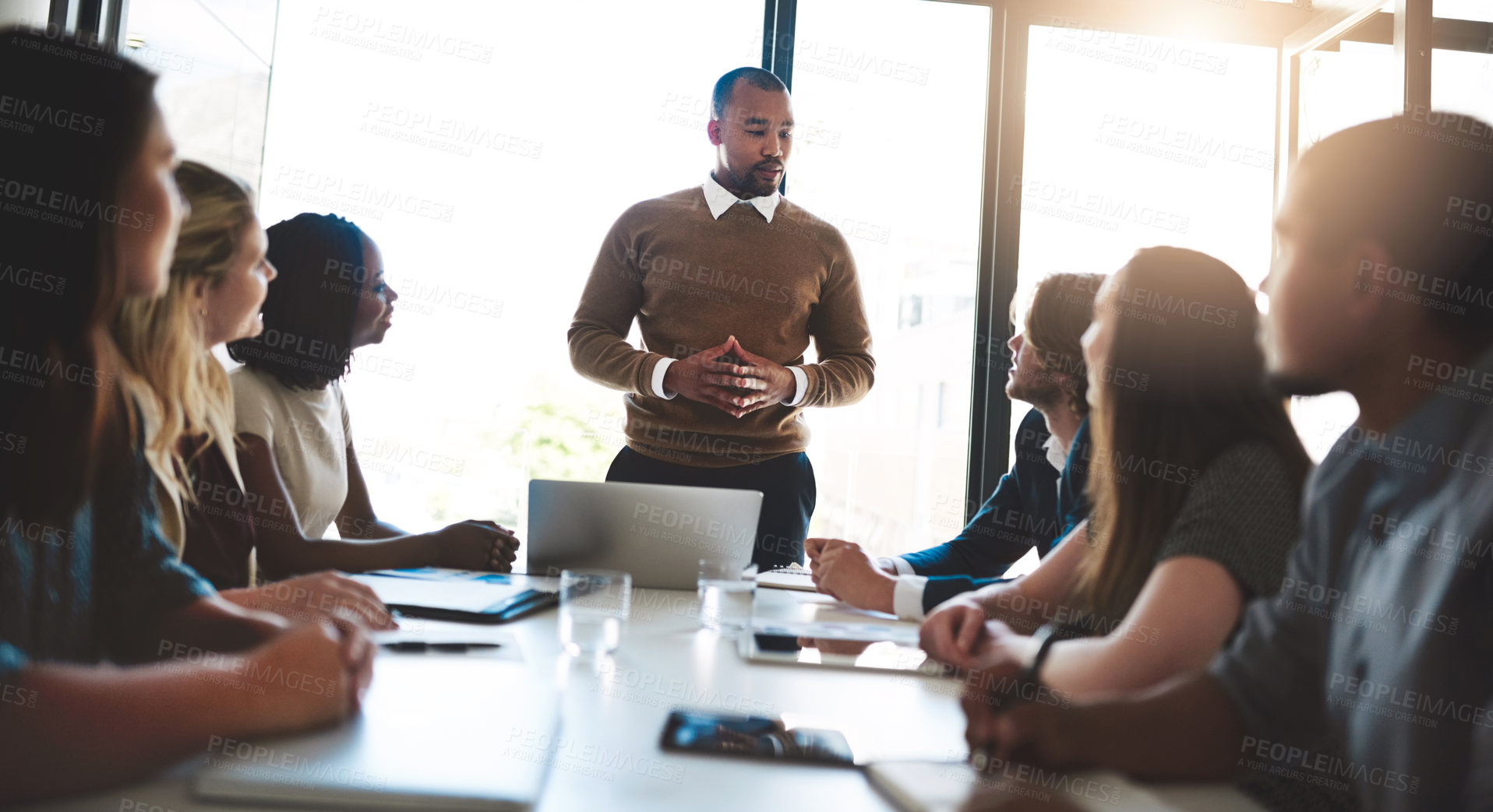 Buy stock photo Business, man and discussion for meeting in office with leadership, brainstorming and performance feedback. Presenter, people and team coaching with laptop, finance training and project presentation