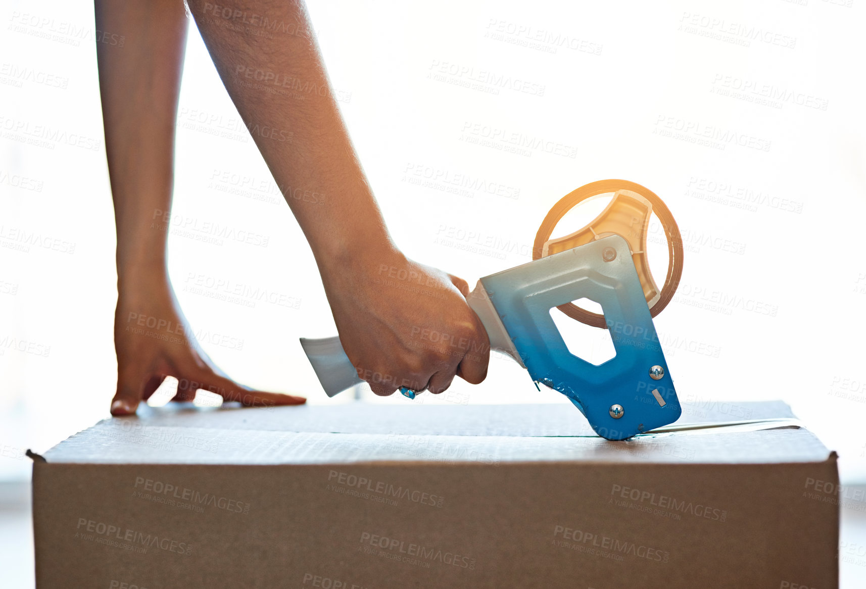 Buy stock photo Hands, person and close box with tape at home, packaging for new house or fragile parcel. Protection, equipment or shipping with tool, cardboard or move with supply chain, commerce process or closeup