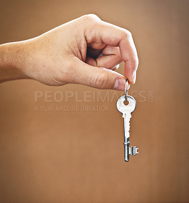 Buy stock photo Cropped shot of an unrecognizable man's hand holding the key to his new home