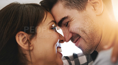 Buy stock photo Shot of a happy young couple celebrating their move into a new home