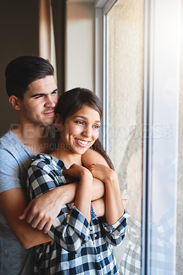 Buy stock photo Couple, hug and window of home for peace, support and bonding on weekend for relationship. People, reflection and embrace for security in connection, relax and together for date on trip for marriage