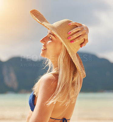 Buy stock photo Girl, calm and bikini on beach in summer with hat for tropical vacation or trip, happiness and relax with sunshine. Woman, eyes closed and outdoor by sea in California for holiday, break and travel.