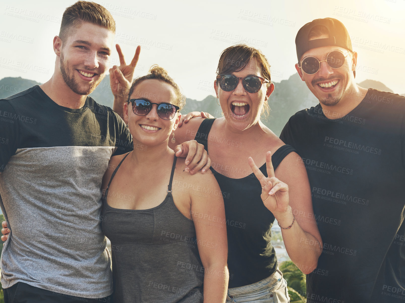 Buy stock photo Portrait of a happy group of friends posing together outside