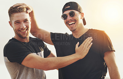 Buy stock photo Portrait of two happy friends enjoying the day outside together